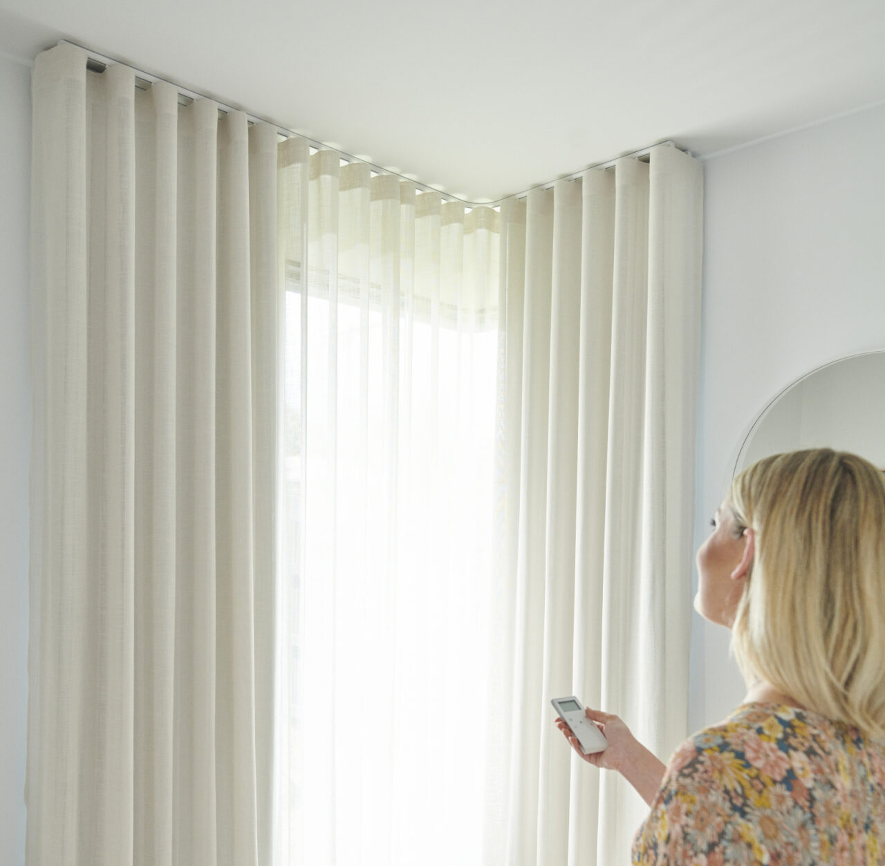 Motorised curtains operated by handheld remote control